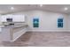 Open dining area with wood-look flooring and vaulted ceiling at 386 Marion Oaks Trl, Ocala, FL 34473