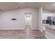 View down a hallway, connecting to kitchen and bedrooms at 386 Marion Oaks Trl, Ocala, FL 34473