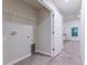 Laundry room with shelving and access to hallway at 386 Marion Oaks Trl, Ocala, FL 34473