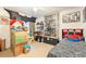 This bedroom is adorned with collectibles, memorabilia and features a unique decor at 4000 San Gallo Dr # 102, Kissimmee, FL 34741