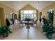 Elegant clubhouse lobby with high ceilings, comfortable seating, and beautiful floral arrangements at 4000 San Gallo Dr # 102, Kissimmee, FL 34741