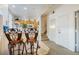 Bright kitchen featuring a breakfast bar with seating, tiled floor, and convenient access to the staircase at 4000 San Gallo Dr # 102, Kissimmee, FL 34741