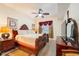 Primary bedroom with elegant furnishings, ceiling fan, and cozy carpeting for a comfortable retreat at 4000 San Gallo Dr # 102, Kissimmee, FL 34741