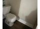 Small bathroom with white toilet and vinyl flooring at 428 Sand Lime Rd, Winter Garden, FL 34787