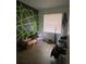 Secondary bedroom with green and gray accent wall and vinyl flooring at 428 Sand Lime Rd, Winter Garden, FL 34787