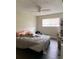 Main bedroom with a large bed, and light brown floors at 428 Sand Lime Rd, Winter Garden, FL 34787