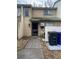 Tan exterior condo with a walkway, landscaping, and solar panels at 428 Sand Lime Rd, Winter Garden, FL 34787
