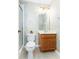 Bathroom with wood vanity, toilet and shower at 4525 Stella St, Kissimmee, FL 34746