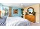Spacious bedroom with king-size bed and large dresser at 4525 Stella St, Kissimmee, FL 34746