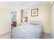 Bedroom featuring a twin bed, nightstand and en-suite bathroom at 4525 Stella St, Kissimmee, FL 34746