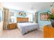 Main bedroom with king bed, stylish decor and natural light at 4525 Stella St, Kissimmee, FL 34746