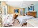 Spacious bedroom with large bed, crib, and plenty of natural light at 4525 Stella St, Kissimmee, FL 34746