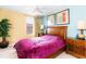 Bedroom with a double bed, two nightstands, and ceiling fan at 4525 Stella St, Kissimmee, FL 34746