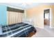 Bedroom with crib and ensuite bathroom access at 4525 Stella St, Kissimmee, FL 34746