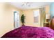 Bright bedroom with a double bed, nightstand and ceiling fan at 4525 Stella St, Kissimmee, FL 34746