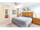 Main bedroom with king-size bed and ensuite bathroom access at 4525 Stella St, Kissimmee, FL 34746