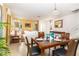 Bright dining area with wood table and chairs near living space at 4525 Stella St, Kissimmee, FL 34746