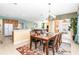 Bright dining room features a large table and access to the backyard at 4525 Stella St, Kissimmee, FL 34746