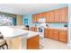 Modern kitchen with light wood cabinets and ample counter space at 4525 Stella St, Kissimmee, FL 34746