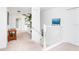 Upstairs hallway with carpeting, a staircase, and plenty of natural light at 4525 Stella St, Kissimmee, FL 34746