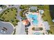 Community pool and clubhouse with lake view at 4976 Windermere Ave, Kissimmee, FL 34746