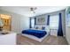 Spacious bedroom with a king-size bed and en-suite bathroom at 4976 Windermere Ave, Kissimmee, FL 34746