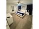 Inviting bedroom with a queen-size bed, neutral decor, and ample closet space at 4976 Windermere Ave, Kissimmee, FL 34746