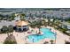 Aerial view of community pool with residents enjoying the area at 4976 Windermere Ave, Kissimmee, FL 34746