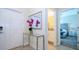 Bright entryway with glass console table and mirror at 4976 Windermere Ave, Kissimmee, FL 34746