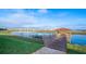 Scenic view of lake with a wooden gazebo and dock at 4976 Windermere Ave, Kissimmee, FL 34746