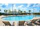 Inviting community pool with lounge chairs and umbrellas at 4976 Windermere Ave, Kissimmee, FL 34746