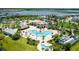Community pool with a large deck and lounge chairs at 4976 Windermere Ave, Kissimmee, FL 34746