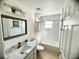 Clean bathroom with a shower/tub combo and white tile at 509 Drayton Rd, Winter Haven, FL 33884