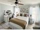 Cozy bedroom with a queen-size bed and large wall art at 509 Drayton Rd, Winter Haven, FL 33884
