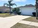 House exterior with a two-car garage and driveway at 509 Drayton Rd, Winter Haven, FL 33884