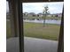 View of a backyard with a lake and houses in the distance at 522 Noble Ave, Davenport, FL 33837