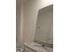 Clean bathroom, granite countertop, and a large mirror at 522 Noble Ave, Davenport, FL 33837