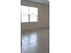 Dining area with tile flooring and a large window at 522 Noble Ave, Davenport, FL 33837