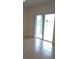 Dining area with sliding glass doors leading to a patio and lake view at 522 Noble Ave, Davenport, FL 33837