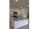 Kitchen with white cabinets, granite countertops, and stainless steel appliances at 522 Noble Ave, Davenport, FL 33837