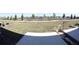 Spacious backyard view featuring a concrete patio and lush greenery at 697 Stoney Point Cir, Davenport, FL 33896