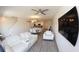 Bright and airy living space with modern furnishings, hardwood floors, and plenty of light at 697 Stoney Point Cir, Davenport, FL 33896