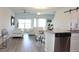 Open floor plan with a living room, dining room and kitchen, ideal for modern living at 697 Stoney Point Cir, Davenport, FL 33896