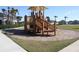Community playground features modern equipment on a wood chip safety surface at 697 Stoney Point Cir, Davenport, FL 33896