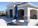 Poolside patio with table and seating at community pool at 697 Stoney Point Cir, Davenport, FL 33896