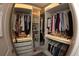 Walk-in closet with built-in shelving and clothing racks at 697 Stoney Point Cir, Davenport, FL 33896