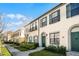 Townhouse exterior showcasing architectural details and landscaping at 709 Centervale Dr, Celebration, FL 34747