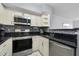 Updated kitchen featuring stainless steel appliances and granite counters at 709 Centervale Dr, Celebration, FL 34747