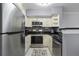 Modern kitchen with stainless steel appliances and light-colored cabinets at 709 Centervale Dr, Celebration, FL 34747
