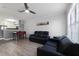 Living room features a contemporary design with dark leather furniture at 709 Centervale Dr, Celebration, FL 34747